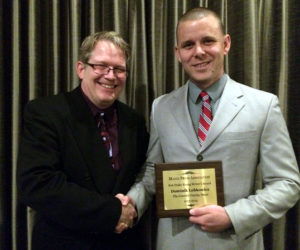 Lincoln County News Editor Sherwood Olin congratulates Dominik Lobkowicz following the presentation of the Bob Drake Young Writer's Award at the Hilton Garden Inn in Auburn Saturday, Oct. 18. (J.W. Oliver photo)