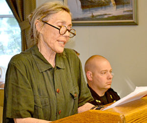 Sharon Mrozinski, proprietor of The Marston House, reads a letter signed by about 26 business owners opposing the Maine Department of Transportationâ€™s design proposals for Wiscasset village, at the Wiscasset Board of Selectmenâ€™s Tuesday, May 31 meeting. (Abigail Adams photo)