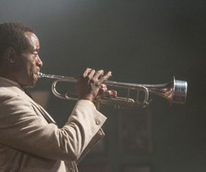 Don Cheadle as Miles Davis.