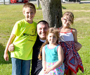 Ben Leeman with his children Wesley, Georgia, and Aurora in Wiscasset on Friday, June 10. Leeman is using his experience as a veteran who struggled to return to civilian life to help others. (Abigail Adams photo)