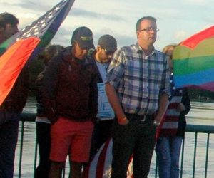 Ben Connon, of Rockland, stands on the Damariscotta-Newcastle bridge during a silent vigil for the victims of the shooting in Orlando. With tears streaming down his face, he said, "I lived in south Florida and I knew two of the men who were killed. I am grateful to see how strong the community is here." (Eleanor Cade Busby photo)