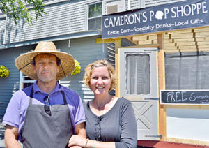 Wade Cameron Ingham and Jennifer Ingham stand in front of their new store, Cameron’s Pop Shoppe, at 49 Main St. in Wiscasset on June 15. (Haley Bascom photo)