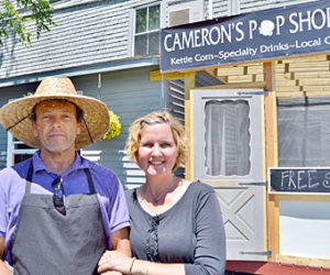 Wade Cameron Ingham and Jennifer Ingham stand in front of their new store, Cameron’s Pop Shoppe, at 49 Main St. in Wiscasset on June 15. (Haley Bascom photo)