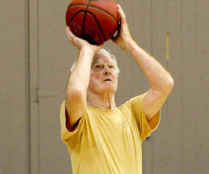 Tom Justice, 81, of Jefferson, takes a shot at the CLC YMCA in Damariscotta on Monday. Justice plays menâ€™s basketball during the CLC Yâ€™s pickup games at noon with men a quarter of his age and up. (Paula Roberts photo)