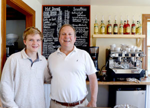 Jim Matel and his son Teddy Matel man the counter at the new Round Pond Coffee shop on Route 32 across from the Granite Hall Store in Round Pond. The shop opened Monday, June 27. (Haley Bascom photo)