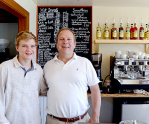 Jim Matel and his son Teddy Matel man the counter at the new Round Pond Coffee shop on Route 32 across from the Granite Hall Store in Round Pond. The shop opened Monday, June 27. (Haley Bascom photo)