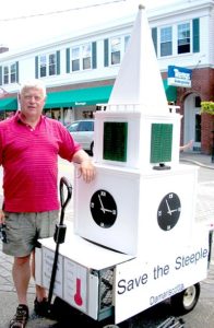 Steeple Fundraising Committee Chairman Walter Hilton stands next to a model of the Damariscotta Baptist Church steeple in downtown Damariscotta in July 2010. (LCN file photo)
