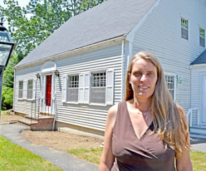 Pemaquid Watershed Association Executive Director Jennifer Hicks stands in front of the organization’s headquarters in Damariscotta. (Maia Zewert photo)