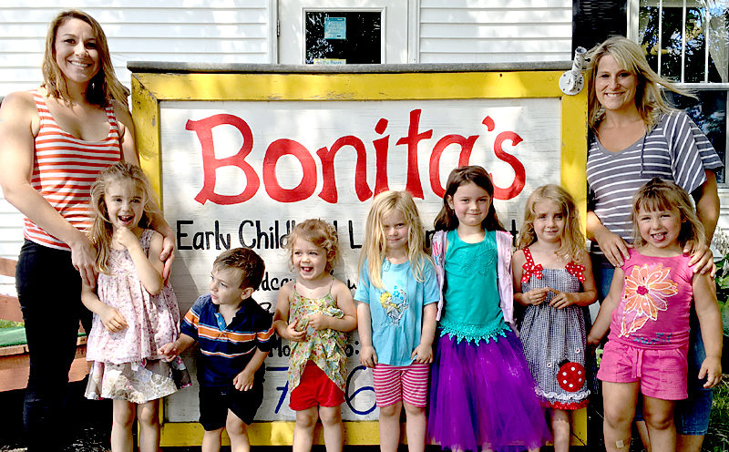 Kristin Morgner (far left) and Kira Gallant (far right) with some of the children from the "radishes" classroom at Bonita's Early Childhood Learning Center in Damariscotta. Gallant is the new owner of the business as of July 1; Morgner, the previous owner, will leave in mid-August for Pennsylvania. (J.W. Oliver photo)