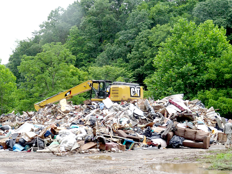 Every couple of miles in West Virginia, residents' personal possessions can be seen piled into garbage heaps after being destroyed in late June floods. (Photo courtesy Diana Blanchette)