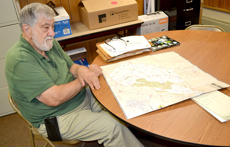 Dr. Jack Sarmanian, of Edgecomb, a Red Cross disaster mental health worker, looks over a map of West Virginia on Tuesday, July 12, following his return from a deployment to assist flood victims. (Abigail Adams photo)