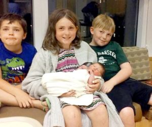 From left: siblings Joseph, Emily, and Gary James Tibbetts sit with their new sister, Madeline Peaslee. The children's mother, Andrea Tibbetts, gave birth to Madeline hours after she was in a car accident on Route 1 in Newcastle the afternoon of Tuesday, July 5. (Photo courtesy Andrea Tibbetts)