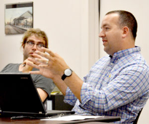 Newcastle Town Administrator Jon Duke discusses an application for street vendors during his first Newcastle Board of Selectmen meeting as town administrator Monday, July 11. Selectman Joel Lind looks on. (Haley Bascom photo)