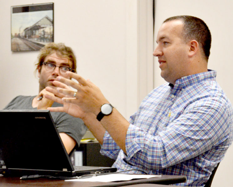 Newcastle Town Administrator Jon Duke discusses an application for street vendors during his first Newcastle Board of Selectmen meeting as town administrator Monday, July 11. Selectman Joel Lind looks on. (Haley Bascom photo)