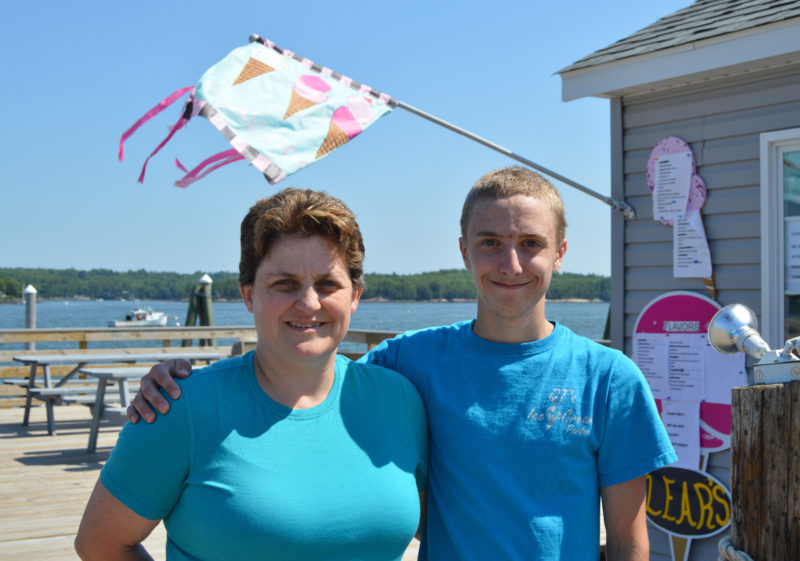 QT's Ice Cream Parlor owner Tammy Brooks and her son Keagan stand in front of the new location of QT's Ice Cream Parlor at 2 Water St. in Wiscasset on July 13. QT's opened at the new location June 3 after 10 weeks of construction and preparations. (Haley Bascom photo)