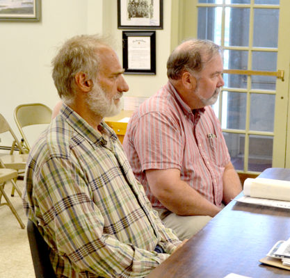 The Power Co. representative Richard Simon (left) and Coastal Enterprises Inc. representative John Egan appear before the Wiscasset Planning Board on Monday, July 11. The board approved CEI's application to install six additional solar panels at its Deer Ridge Apartments in Wiscasset. (Charlotte Boynton photo)
