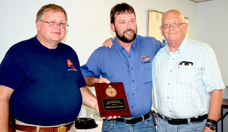 From left: Lincoln County Fire Chiefs Association Vice President Walter Morris presents the Chief Bob Maxcy Lifetime Achievement Award to former Bristol 3rd Assistant Fire Chief Neil Kimball as Bristol Fire Chief Paul Leeman Jr. looks on. (J.W. Oliver photo)