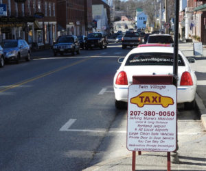 A Twin Village Taxi waits by the the curb in downtown Damariscotta. (Photo courtesy Nancy Hatch)