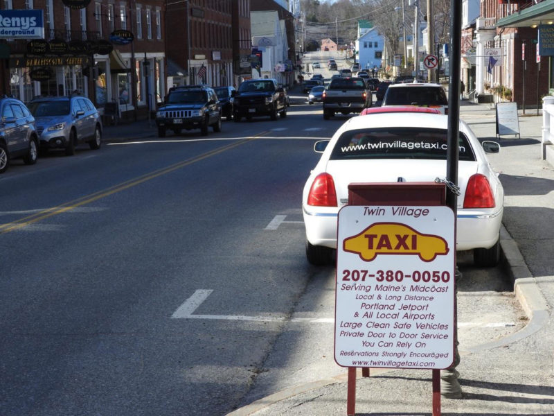 A Twin Village Taxi waits by the the curb in downtown Damariscotta. (Photo courtesy Nancy Hatch)