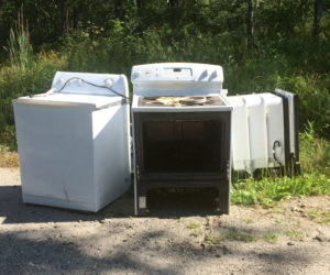 A washing machine and stove were among appliances dumped on Gilmore Brook Road in Dresden in early August. (Photo courtesy Allan Moeller)