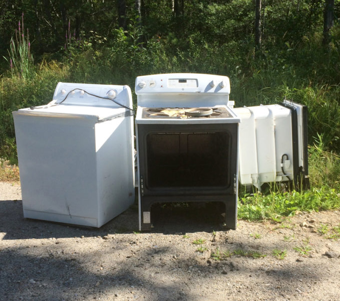 A washing machine and stove were among appliances dumped on Gilmore Brook Road in Dresden in early August. (Photo courtesy Allan Moeller)