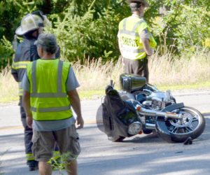 A 2016 Harley-Davidson motorcycle lays on its side on Pond Road in Newcastle after an accident the afternoon of Sunday, Aug. 7. The driver and passenger were transported to LincolnHealth's Miles Campus by ambulance. (Maia Zewert photo)