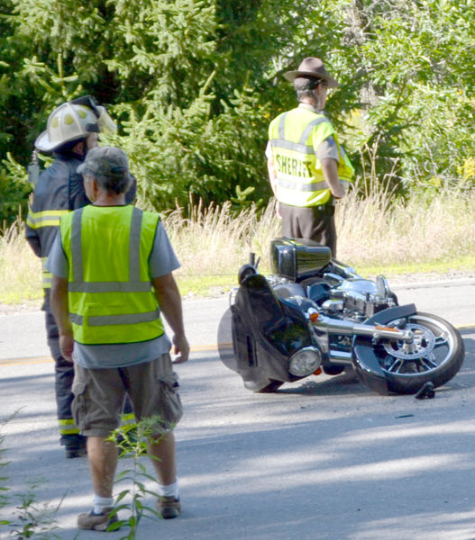 A 2016 Harley-Davidson motorcycle lays on its side on Pond Road in Newcastle after an accident the afternoon of Sunday, Aug. 7. The driver and passenger were transported to LincolnHealth's Miles Campus by ambulance. (Maia Zewert photo)