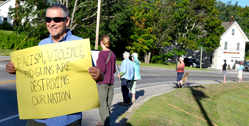 Mark Hamilton, of Walpole, participates in a vigil against racism at Veterans Memorial Park in Newcastle on Monday, Aug. 22. (Maia Zewert photo)