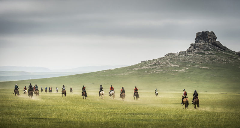 Mongol Derby participants cross the Mongolian Steppe on the first day of the race. The riders have 10 days to complete the 1,000-kilometer course. (Photo courtesy Richard Dunwoody/richarddunwoodyphotography.com)