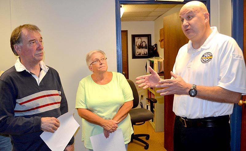 From left: Wiscasset Selectmen Ben Rines and Judy Colby listen as Wiscasset Ambulance Service Director Toby Martin explains the department's needs during the selectmen's tour of the department Monday, Sept. 12. (Abigail Adams photo)