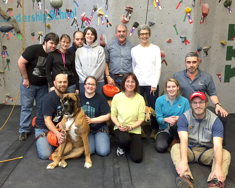 Embrace A Vet participants, with the assistance of Kieve-Wavus staf,f climb on KieveÂ’s indoor climbing facility on the Nobleboro campus.