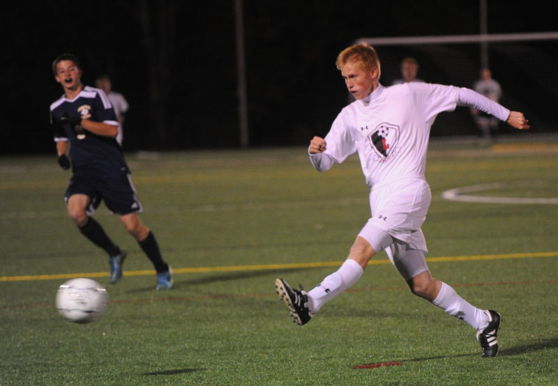 Lincoln Academy defender Logan Eckel clears the ball in the Eagles 1-0 loss to Medomak Valley.