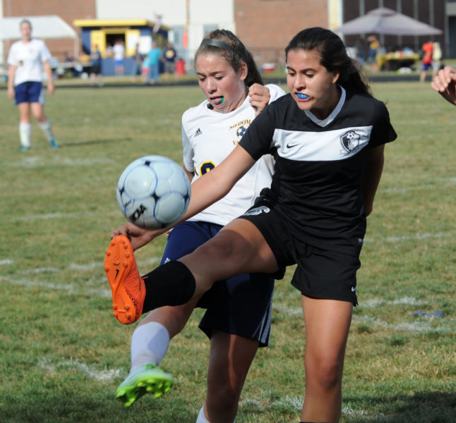 Lady Eagle Cate Organ plays the ball as Lady Panther Audrey Schaffer defends. (Paula Roberts photo)