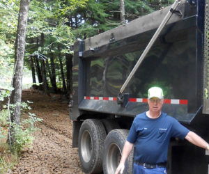 Alan Johnston, owner of A.J. Construction and a Jefferson Fire and Rescue volunteer, prepares to install a fire hydrant at Turner Pond in Somerville. (Photo courtesy Mary Throckmorton)