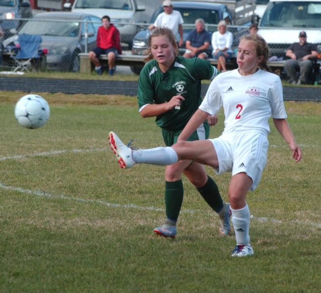 Lady Wolverine Stephanie Jones passes the ball up the field in Wiscasset's win over Carrabec. (Carrie Reynolds photo)