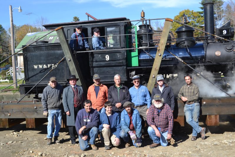 Wiscasset, Waterville & Farmington Railway Museum volunteers stand in front of Engine No. 9 on the museum's new turntable Saturday, Oct. 15. Front from left: Eric Shade, Ben Shade, James Patten,  and Bob Holmes. Middle: Zach Wyllie, Steve Zuppa, Mike Fox, Phil Goodwin, Randy Beach, John Robertson, and Jason Lamontagne. Back: J.B. Smith and Gordon Cook. (Abigail Adams photo)