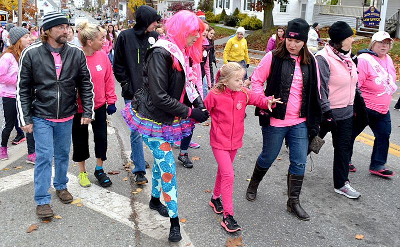 Breast cancer survivors and supporters of efforts to combat breast cancer walk through Damariscotta during the Making Strides Against Breast Cancer event Sunday, Oct. 23. (Maia Zewert photo)