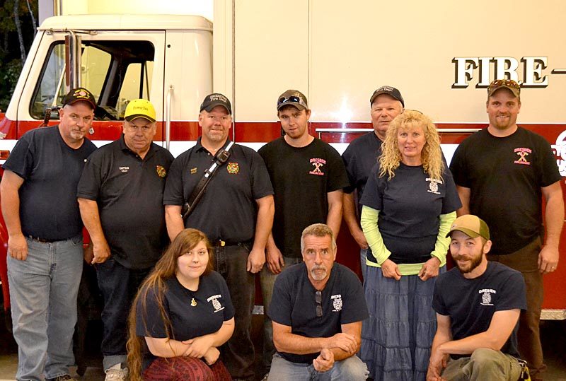 Members of the Dresden Fire Department at their annual open house Wednesday, Oct. 5, after a week of several difficult emergency calls. Back from left: Ike Heffron, Gorham Lilly, Chief Steve Lilly, Tyler Cray, Gerald Lilly, Susan Lilly, and Andrew Spicer. Front: Sabrina Dora, Mike Nylan, and Brendan Parker. (Abigail Adams photo)