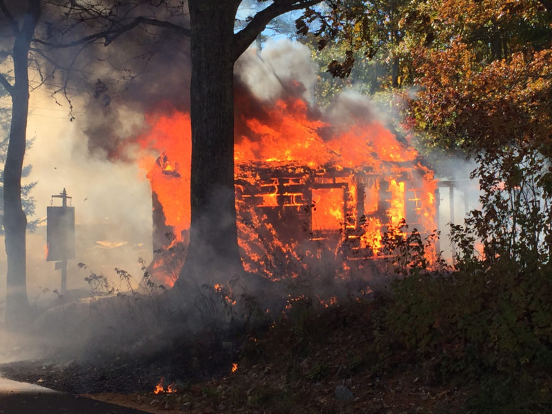 A structure burns on North Dyer Neck Road in Newcastle. (Maia Zewert photo)