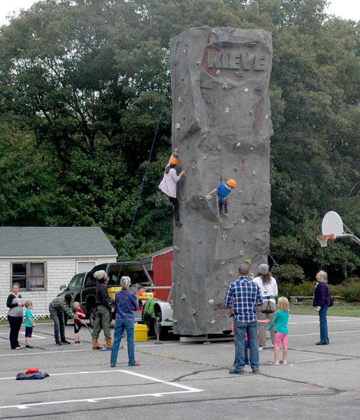 The Leadership School at Kieve-Wavus brought its climbing wall to AppleFest on Saturday, Oct. 1. (Alexander Violo photo)