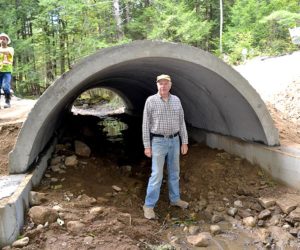 Whitefield Board of Selectmen Chairman Dennis Merrill stands at the entrance to the new Vigue Road culvert on Wednesday, Sept. 28, as crews from McGee Construction continue work. (Abigail Adams photo)