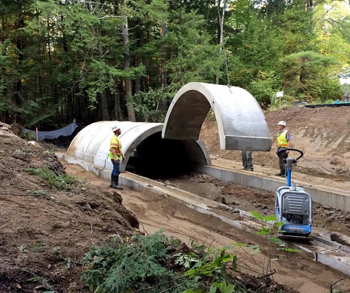 A crew from McGee Costruction installs the concrete arches of the new Vigue Road culvert in Whitefield on Tuesday, Sept. 27. (Photo courtesy Garrison Beck)