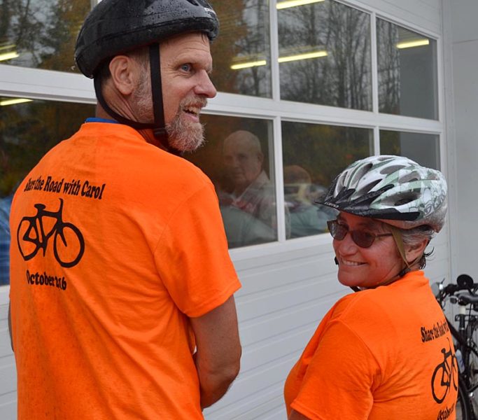 Tom Bartol and Barbara Moss arrive at the Windsor Volunteer Fire Department for Dr. Carol Eckert's memorial service Saturday, Oct. 22, after biking through the rain from Augusta. (Abigail Adams photo)