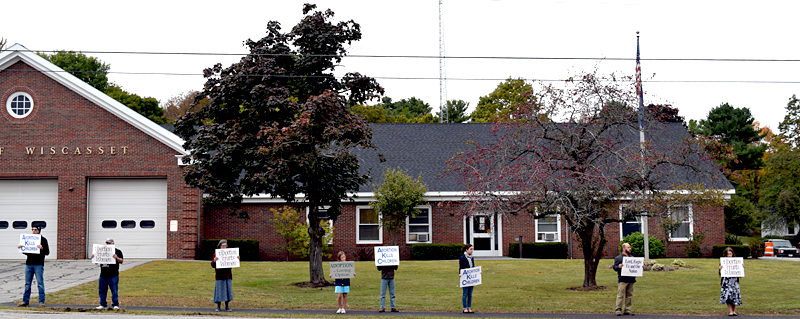 Life Chain participants hold signs on a sidewalk in front of the Wiscasset municipal building Sunday, Oct. 2. (J.W. Oliver photo)