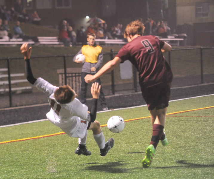 Nolen Michael has his feet kicked out from under him by Freeport's Shea Wagner.