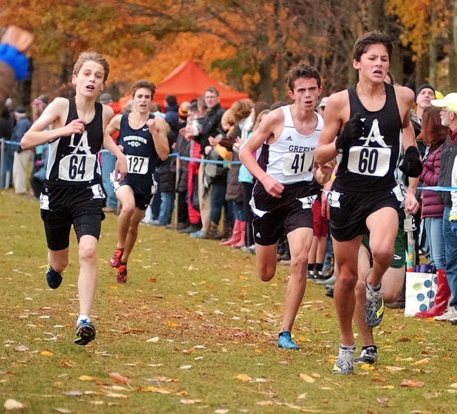 Lincoln Academy runners Benji Pugh and Jarrett Gulden run at the South B Regionals in the rain on Oct. 29.  (Carrie Reynolds photo)