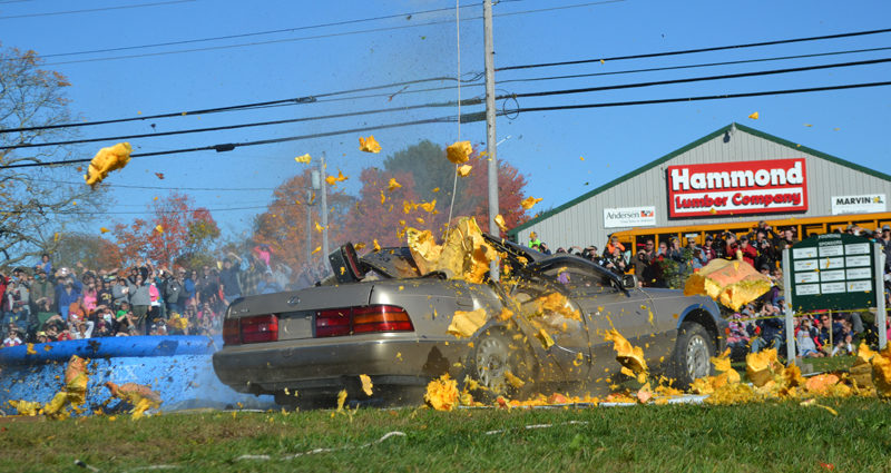 After a 145-foot drop, a pumpkin smashes into a Lexus during the final event of the 2016 Damariscotta Pumpkinfest on Monday, Oct. 10. (Maia Zewert photo)