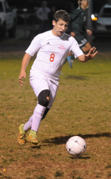 Russell Marr carries the ball up the field for Wiscasset. (Paula Roberts photo)