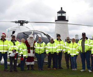 Bristol firefighters and first responders pose with Santa Claus and the Flying Santa crew during their visit to Pemaquid Point Lighthouse Park on Sunday, Nov. 27. (J.W. Oliver photo)