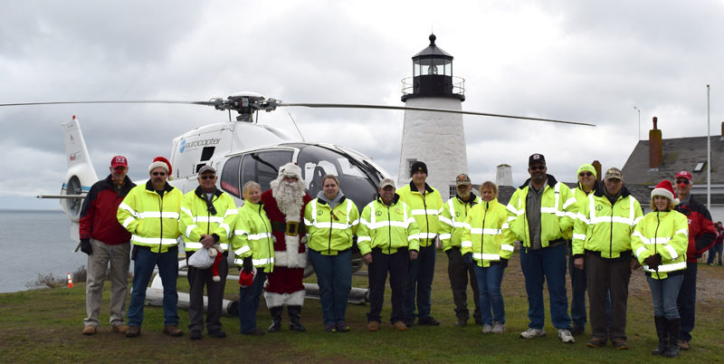 Bristol firefighters and first responders pose with Santa Claus and the Flying Santa crew during their visit to Pemaquid Point Lighthouse Park on Sunday, Nov. 27. (J.W. Oliver photo)